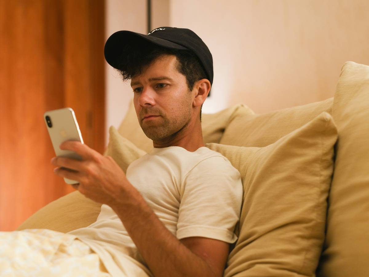 person practicing insomnia cause relief how to help techniques with journal and dim lamp